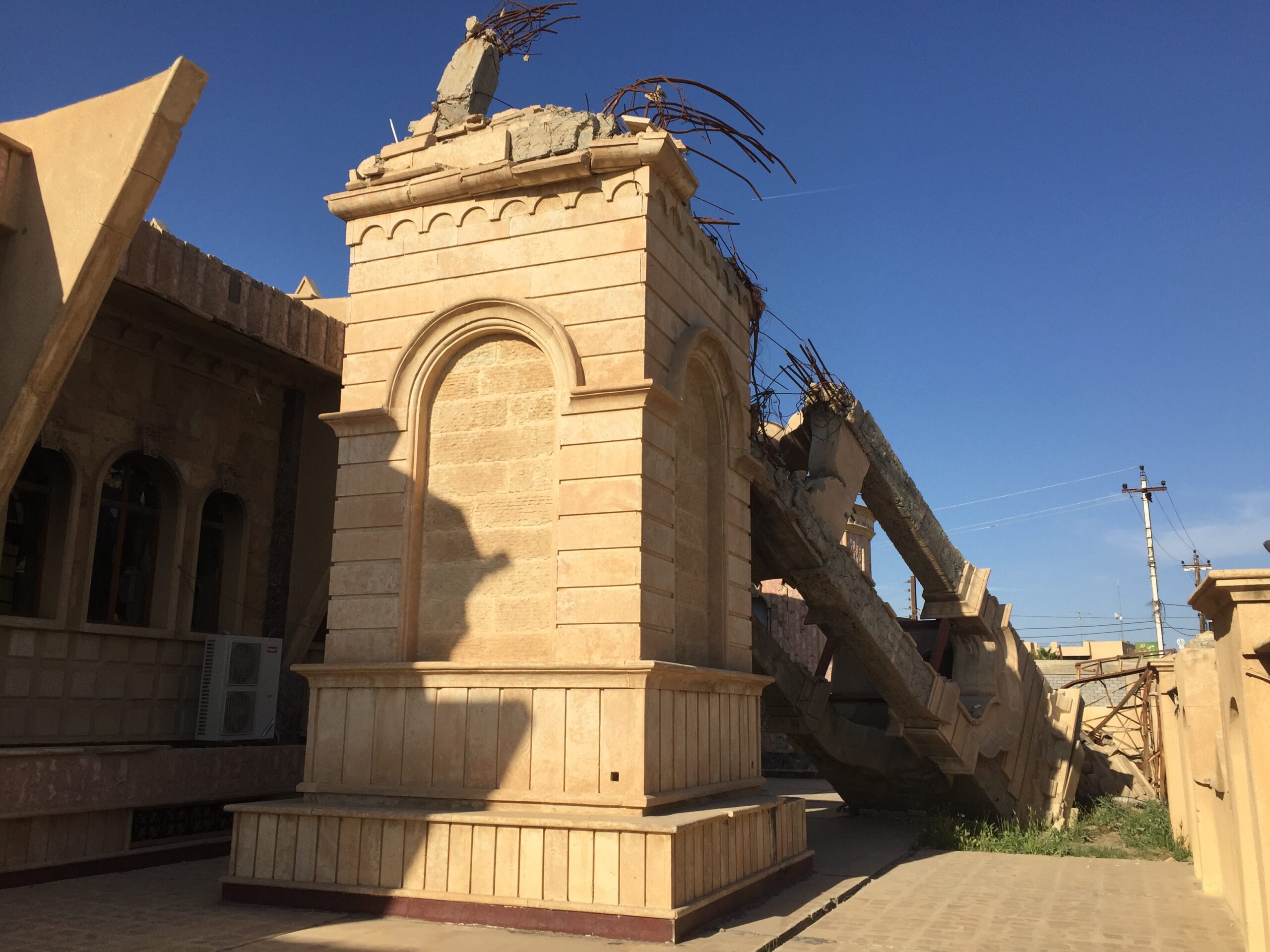 Toppled bell tower in Qaraqosh