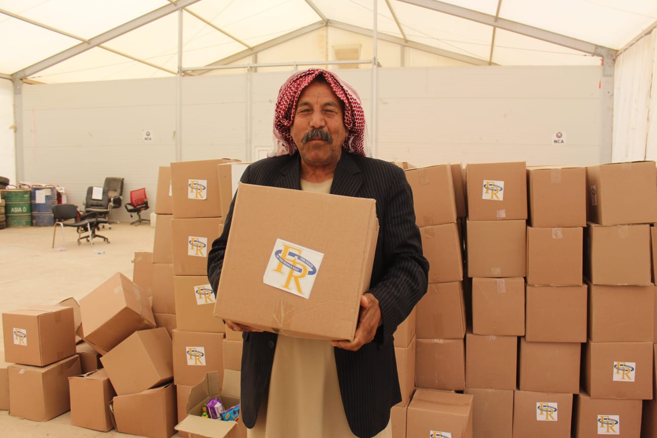 Yazidi-man-receives-one-of-the-FRRME-hygiene-packs
